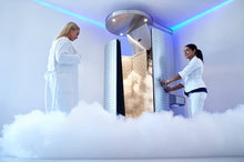 Load image into Gallery viewer, A customer getting into a nitrogen Cryotherapy chamber for weight loss, anti aging, and for less pain and inflammation.