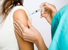 Load image into Gallery viewer, A female customer receiving a Vitamin B injection which has numerous benefits including boosting your energy and metabolism.