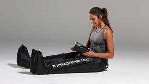 A customer using leg compression sleeves, which helps with lymphatic circulation, varicose veins and leg recovery.